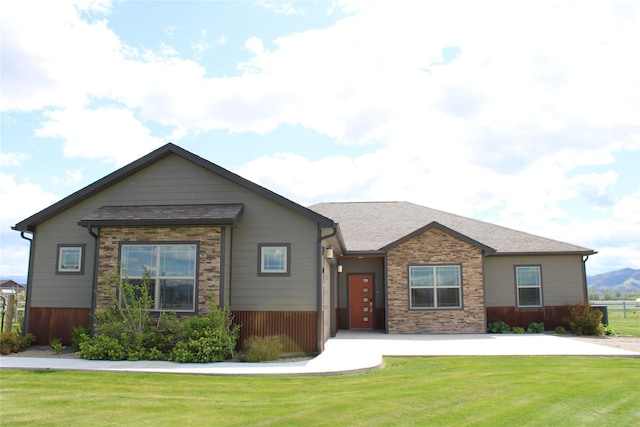 2567 Reardon Rd, Helena, MT 59602 - view of front of home with a front yard, stone siding, and a shingled roof