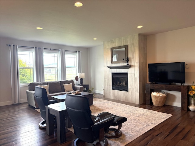 2567 Reardon Rd, Helena, MT 59602 - living area featuring healthy amount of natural light, wood-type flooring, a tiled fireplace, baseboards, and recessed lighting