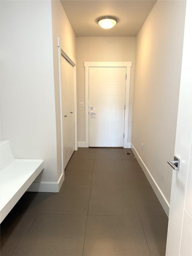 2567 Reardon Rd, Helena, MT 59602 - hall with dark tile patterned floors and baseboards