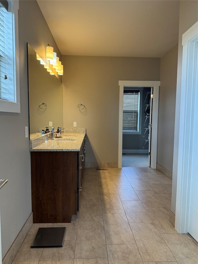 2567 Reardon Rd, Helena, MT 59602 - bathroom with tile patterned flooring, vanity, and baseboards
