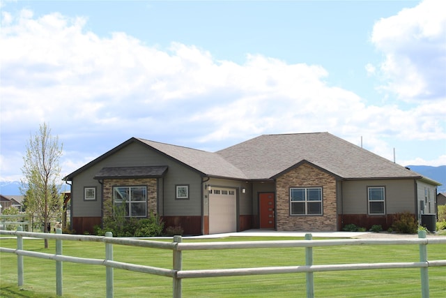 2567 Reardon Rd, Helena, MT 59602 - view of front of property with an attached garage, central air condition unit, stone siding, and roof with shingles