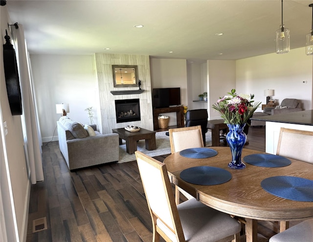 2567 Reardon Rd, Helena, MT 59602 - dining space featuring dark wood-style flooring, baseboards, a large fireplace, and recessed lighting