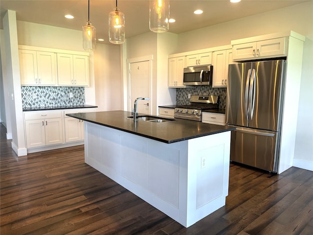 2567 Reardon Rd, Helena, MT 59602 - kitchen featuring stainless steel appliances, a sink, dark countertops, backsplash, and recessed lighting