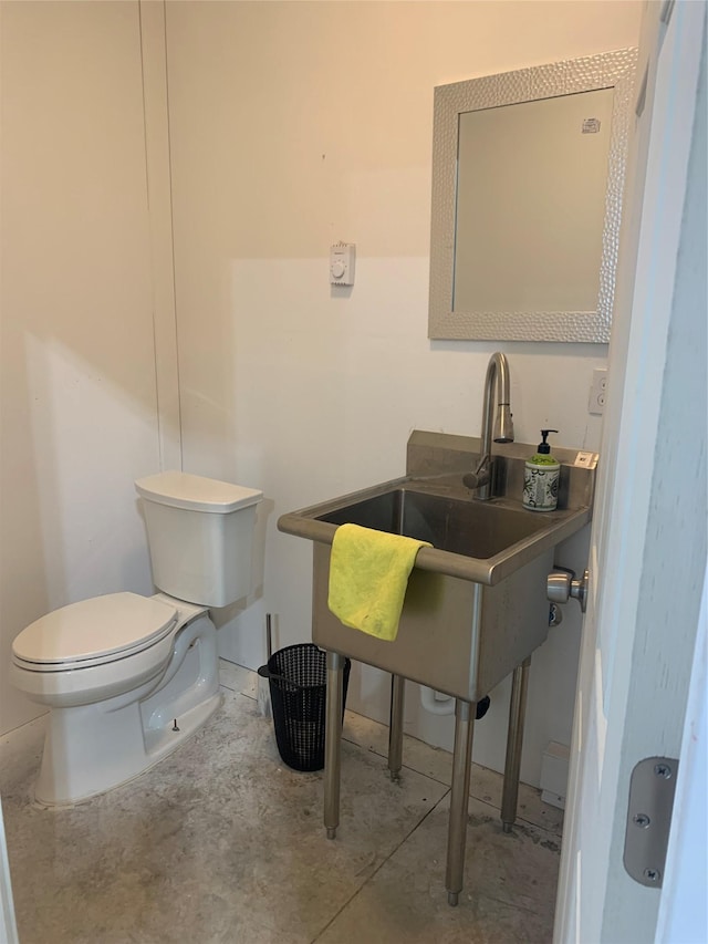 2567 Reardon Rd, Helena, MT 59602 - half bathroom with toilet and concrete flooring