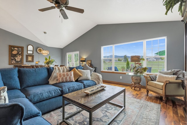 5634 Fairview Ln, Florence, MT 59833 - living area with vaulted ceiling, wood finished floors, and a ceiling fan