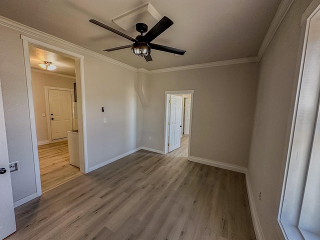 211 W Main St, East Helena, MT 59635 - empty room with wood finished floors, crown molding, baseboards, and a ceiling fan