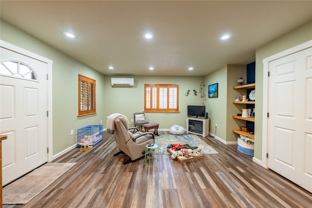 1118 Dakota Ave, Libby, MT 59923 - living room featuring recessed lighting, baseboards, wood finished floors, and a wall mounted air conditioner