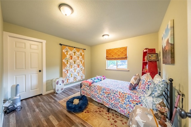 1118 Dakota Ave, Libby, MT 59923 - bedroom with wood finished floors and baseboards