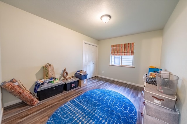 1118 Dakota Ave, Libby, MT 59923 - bedroom featuring wood finished floors, baseboards, and a closet