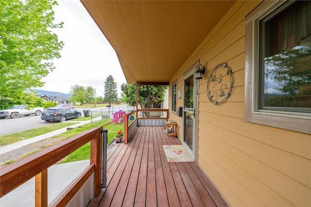 1118 Dakota Ave, Libby, MT 59923 - wooden porch with a mountain view