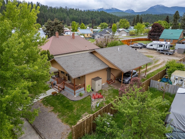 1118 Dakota Ave, Libby, MT 59923 - view of subject property featuring a heavily wooded area and a mountain backdrop