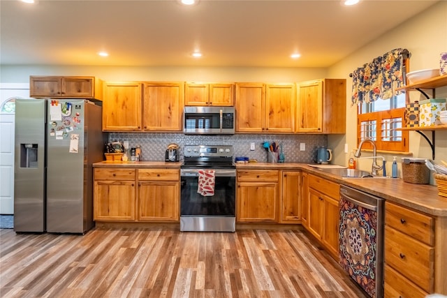 1118 Dakota Ave, Libby, MT 59923 - kitchen featuring stainless steel appliances, open shelves, plenty of natural light, light wood finished floors, and recessed lighting