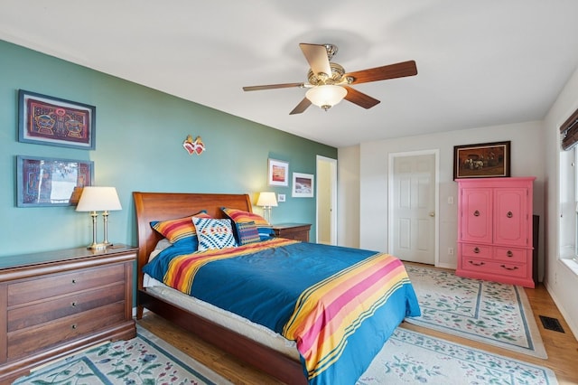 33604 Whitecap Ln, Bigfork, MT 59911 - bedroom featuring wood finished floors and ceiling fan