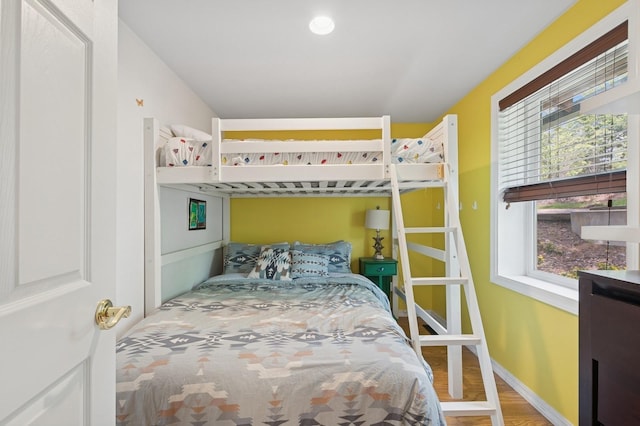 33604 Whitecap Ln, Bigfork, MT 59911 - bedroom featuring wood finished floors and baseboards