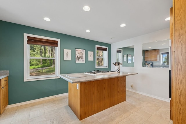 33604 Whitecap Ln, Bigfork, MT 59911 - kitchen featuring a center island, baseboards, recessed lighting, white gas cooktop, and light countertops