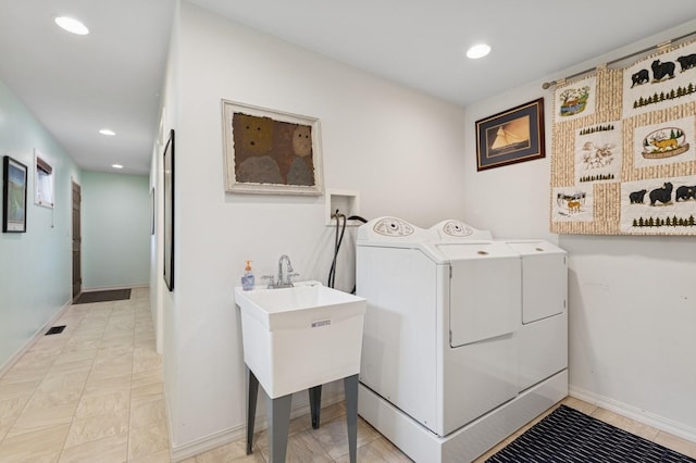 33604 Whitecap Ln, Bigfork, MT 59911 - washroom with washer and clothes dryer, recessed lighting, and baseboards