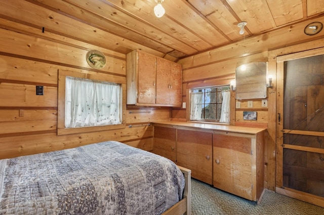 33604 Whitecap Ln, Bigfork, MT 59911 - carpeted bedroom with wooden walls and wood ceiling