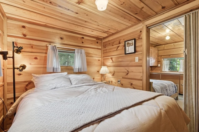 33604 Whitecap Ln, Bigfork, MT 59911 - bedroom featuring wooden ceiling and wooden walls