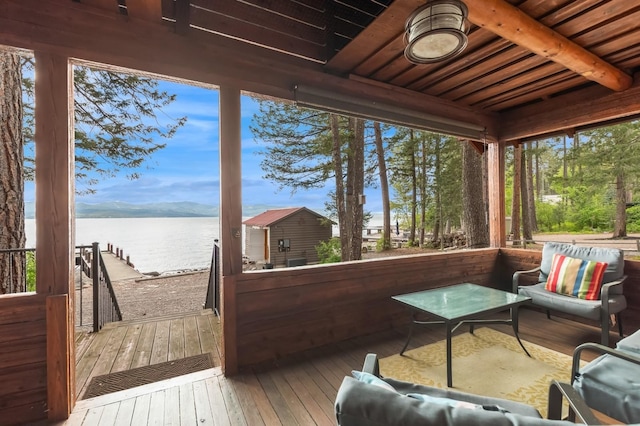 33604 Whitecap Ln, Bigfork, MT 59911 - sunroom featuring a water view and beam ceiling