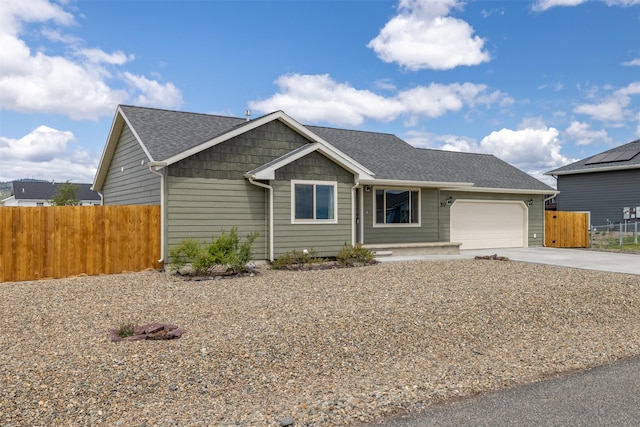 850 Pollux Rd, Helena, MT 59602 - view of front of home with concrete driveway, a garage, and roof with shingles