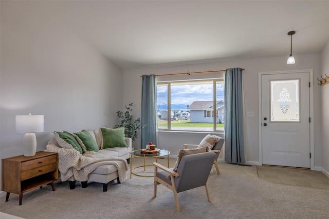 850 Pollux Rd, Helena, MT 59602 - living area featuring light carpet, vaulted ceiling, and baseboards