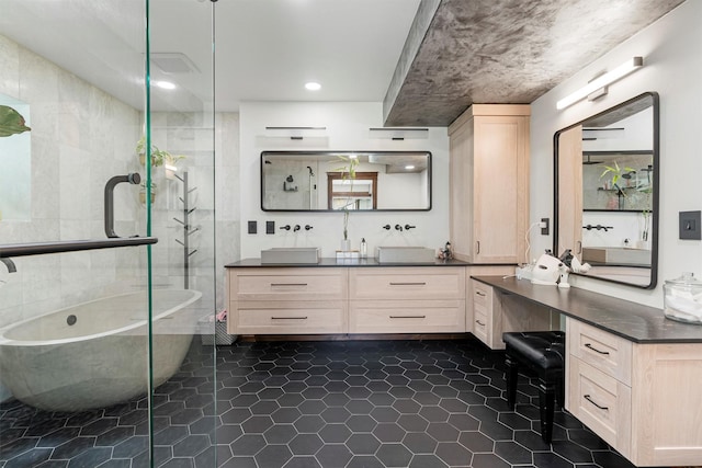 4884 Lower Miller Creek Rd, Missoula, MT 59803 - full bathroom with a soaking tub, vanity, tile patterned floors, and an enclosed shower