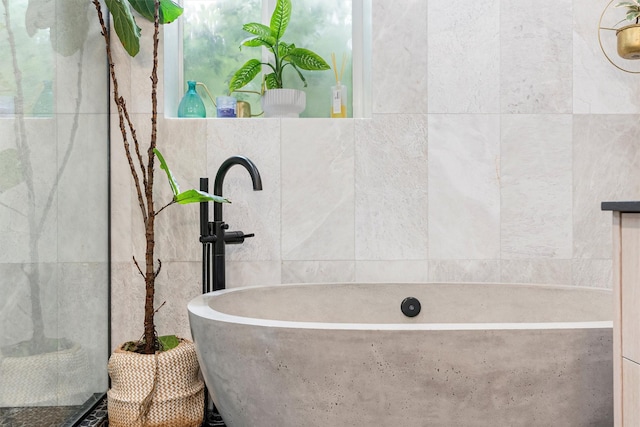 4884 Lower Miller Creek Rd, Missoula, MT 59803 - full bath with a soaking tub and tile walls