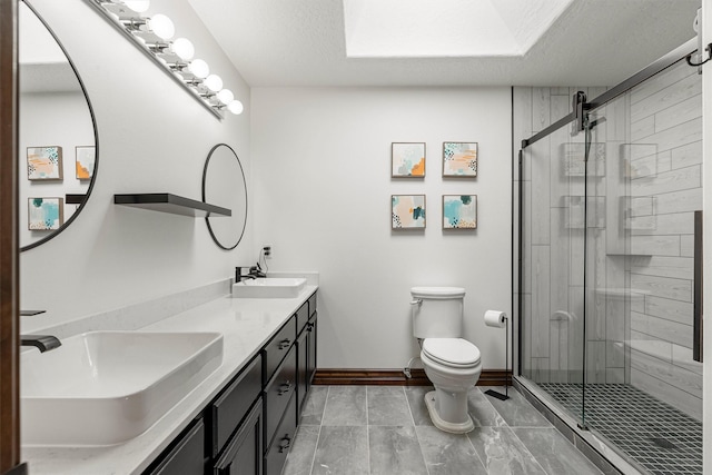 4884 Lower Miller Creek Rd, Missoula, MT 59803 - bathroom with double vanity, a shower stall, and a textured ceiling