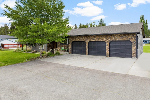 4884 Lower Miller Creek Rd, Missoula, MT 59803 - view of front of house with driveway, a garage, a front lawn, and a shingled roof