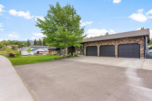 4884 Lower Miller Creek Rd, Missoula, MT 59803 - single story home with asphalt driveway, a garage, a front lawn, and roof with shingles