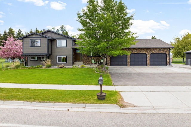 4884 Lower Miller Creek Rd, Missoula, MT 59803 - view of front of home featuring driveway, a front yard, and a garage