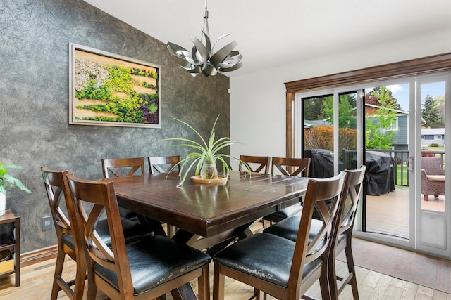 4884 Lower Miller Creek Rd, Missoula, MT 59803 - dining space featuring plenty of natural light, a chandelier, light wood-type flooring, and wallpapered walls