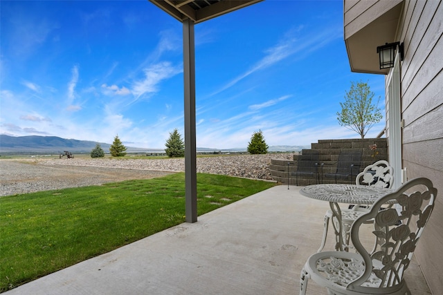 33 Windy Meadow Dr, Townsend, MT 59644 - view of patio / terrace with a mountain view