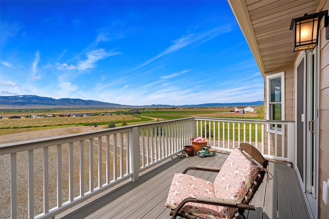 33 Windy Meadow Dr, Townsend, MT 59644 - wooden terrace with a mountain view and a view of rural / pastoral area
