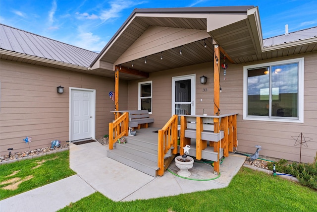 33 Windy Meadow Dr, Townsend, MT 59644 - entrance to property with metal roof and a lawn