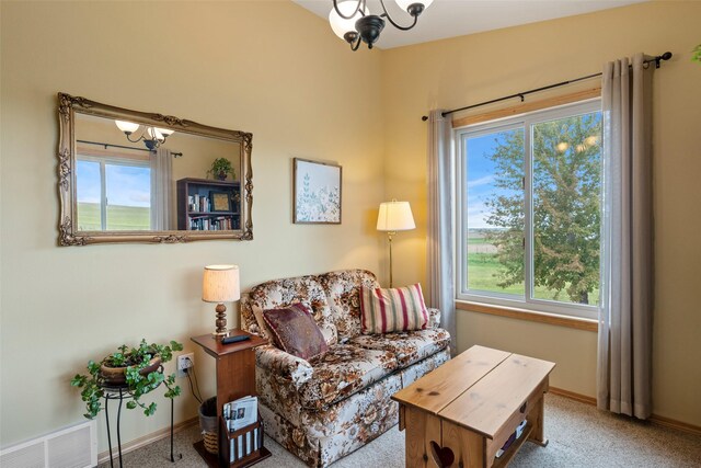 33 Windy Meadow Dr, Townsend, MT 59644 - carpeted living area featuring a chandelier and baseboards