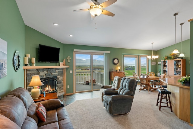 33 Windy Meadow Dr, Townsend, MT 59644 - living room featuring a chandelier, lofted ceiling, ceiling fan, and a stone fireplace