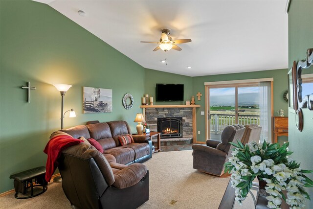 33 Windy Meadow Dr, Townsend, MT 59644 - carpeted living room featuring lofted ceiling, ceiling fan, a fireplace, and baseboards