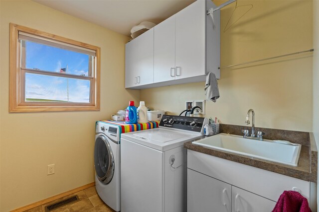33 Windy Meadow Dr, Townsend, MT 59644 - laundry area with separate washer and dryer, cabinet space, and baseboards