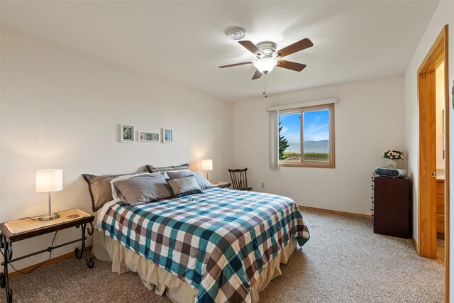 33 Windy Meadow Dr, Townsend, MT 59644 - bedroom with light carpet, baseboards, and a ceiling fan