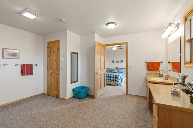 33 Windy Meadow Dr, Townsend, MT 59644 - bathroom featuring carpet, vanity, baseboards, and ensuite bath