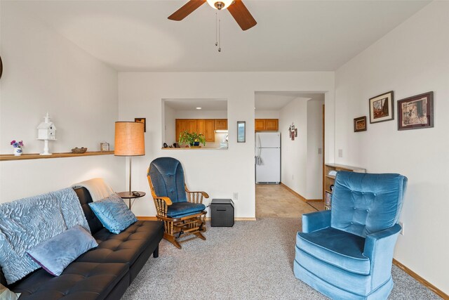 33 Windy Meadow Dr, Townsend, MT 59644 - living room with light colored carpet, a ceiling fan, and baseboards
