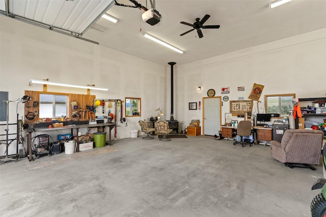 33 Windy Meadow Dr, Townsend, MT 59644 - garage featuring a wood stove, a garage door opener, and electric panel