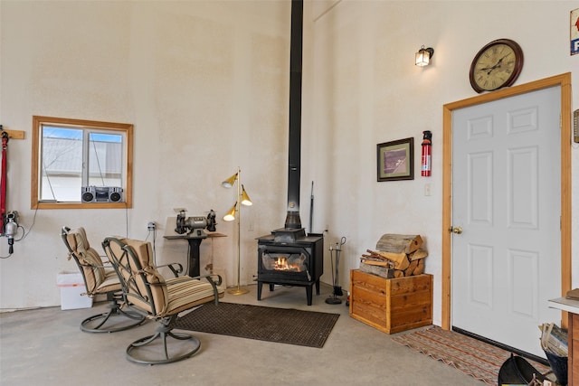 33 Windy Meadow Dr, Townsend, MT 59644 - sitting room featuring a wood stove and concrete flooring