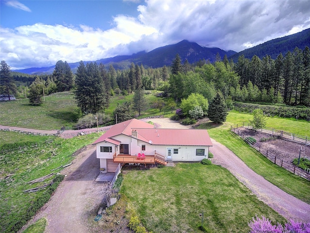 31521 Mcdonald Lake Rd, Saint Ignatius, MT 59865 - aerial view of property and surrounding area featuring mountains and a forest