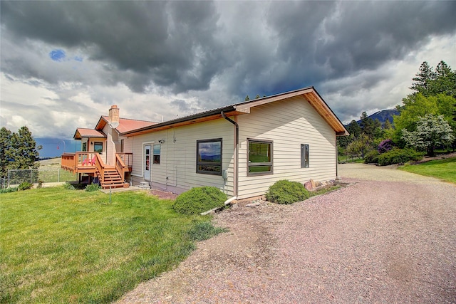 31521 Mcdonald Lake Rd, Saint Ignatius, MT 59865 - view of side of home featuring a deck