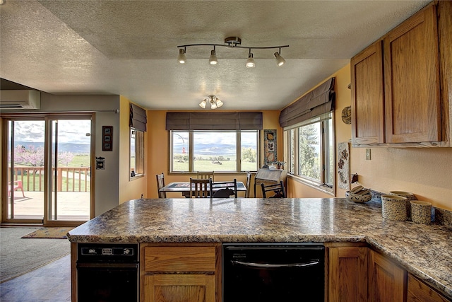 31521 Mcdonald Lake Rd, Saint Ignatius, MT 59865 - kitchen featuring a peninsula, a wall mounted AC, a textured ceiling, and brown cabinetry