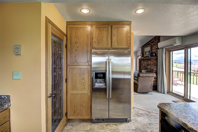 31521 Mcdonald Lake Rd, Saint Ignatius, MT 59865 - kitchen featuring stainless steel refrigerator with ice dispenser, a wall unit AC, a textured ceiling, brown cabinets, and vaulted ceiling