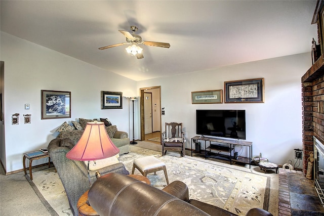 31521 Mcdonald Lake Rd, Saint Ignatius, MT 59865 - living area with a ceiling fan, carpet flooring, a brick fireplace, and baseboards