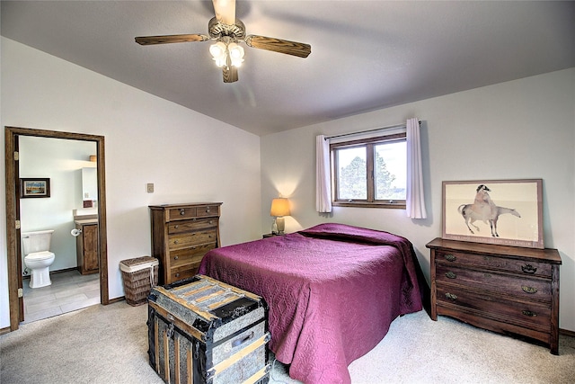31521 Mcdonald Lake Rd, Saint Ignatius, MT 59865 - bedroom with light colored carpet, connected bathroom, ceiling fan, vaulted ceiling, and baseboards